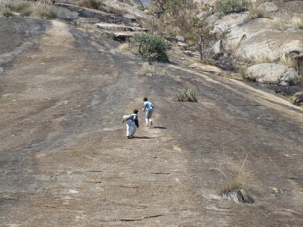 Couple of children taking a risky shortcut